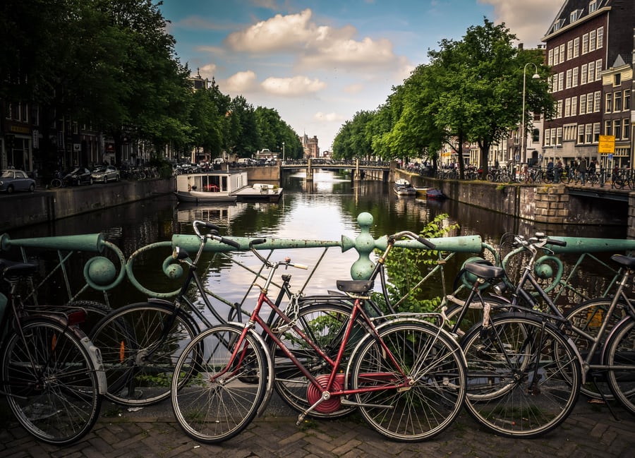 An image of bicycles and a canal in Amsterdam. 